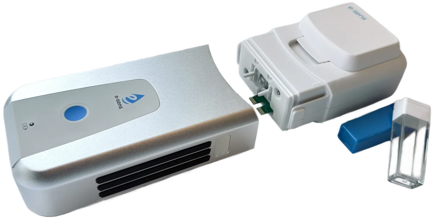 The e-Sens ROAM handheld tester with a reagent cartridge and a sample cuvette